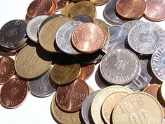 a pile of coins with the words come up with adjustable mattresses on them