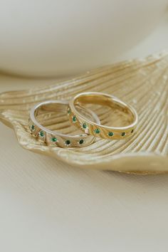 14k gold band with .10 ct round emeralds with star etchings around each stone, set on a wide band. Available in rose, yellow or white gold. Green Wedding Band, Star Wedding Band, Emerald Wedding Band, Emerald Band, Jewelry Design Inspiration, Rose Yellow, Stone Gold, This Is Love, Emerald Stone