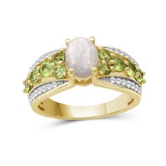 Take your look to the next stylish level with the regal design of this oval-shaped opal and peridot with white lab-created zircon triple-row ring. Fashioned in sterling silver with 14K gold plate Multi-sized spring-green peridot flank the 8.0 x 6.0mm oval-shaped iridescent opal cabochon. Tapered ribbons of white lab-created zircons shimmer along the borders of the shank. Oval Multi-stone Rings For May Birthstone, Multi-stone Oval Rings For May Birthstone, Oval Peridot Multi-stone Jewelry, Oval Peridot Jewelry With Accent Stones, Regal Design, White Lab, Green Peridot, Spring Green, The 8