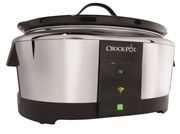 the crock pot is on display in front of a black and white background with green buttons