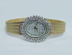 "This is a fabulous ladies vintage pre-owned watch and is made in ITALY!! The entire watch is crafted in 14K yellow gold, the case and the band. There are 90 fiery round cut diamonds set on the dial and around the bezel. The diamonds are estimated to be very clean VS-2-SI-1 in clarity and HI in color (near colorless). Grand total diamond weight is 2 full carats. Very HIGH QUALITY diamonds!! Incredible fire!! Sapphire crystal, Swiss made, quartz movement. The watch is 6-5/8\" (at the longest) wit Diamond Chain Necklace, Wrist Watches, Quality Diamonds, Swiss Made, Round Cut Diamond, Sapphire Crystal, Quartz Movement, Round Cut, Bracelet Watch