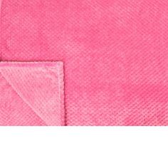 a pink towel folded on top of a white surface with a small square in the middle