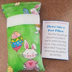 a pillow with an easter bunny on it next to a sign that says please take a port pillow