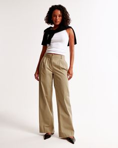 Our signature A&F Sloane Tailored Pant with a low rise, in a soft twill fabric, that's perfect for dressing up or down. The Sloane Tailored Pant is a low rise tailored wide leg pant with figure-flattering pleating details, a functional fly and pockets and a partially elasticated waistband for ultimate adjustability. The intended length hits the bottom of a flat shoe. Please reference our size chart to determine your perfect size and inseam! Sloane Tailored Pant, Tan Pants, Twill Pants, Tailored Pants, Twill Fabric, Tan Color, Bottoms Pants, Abercrombie Fitch, Wide Leg Pants