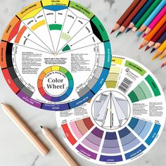 color wheel with pencils and markers next to it