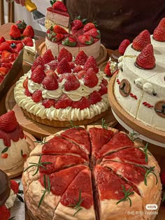 many different types of cakes with strawberries on them