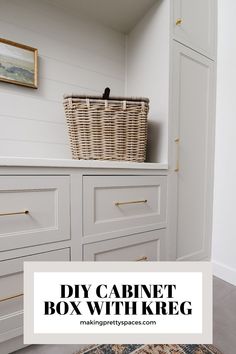 a bathroom with white cabinets and a basket on the wall above it that says diy cabinet box with kreg