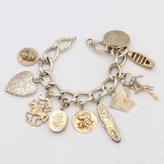 Weight: 56.8 Grams Charms: 17.5 - 23 x 26 mm Bracelet Size:  6.5 Inches Hallmark: F&B, Sterling Item #:  BR-1051-091823-18 Vintage Charm Bracelet, Silver Charm Bracelet, Dream Jewelry, Charm Bracelets, Bracelet Sizes, Vintage Charms, Silver Charms, Arm Band, Hallmark