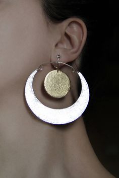 Sun and moon clip on earrings. Lovely inspirational jewelry in silver and gold. Metallic color dangle and drop earrings. Big, statement jewelry - a nice gift for her. Handcrafted with LOVE! Size: 2.9 inch x 2.7 inch 7.4 cm x 6.8 cm They can be made in the following color combinations: 1) Gold sun + Silver moon (crescent) as pictured 2) Gold moon (crescent) + Silver sun 3) Gold moon (crescent) + Copper sun 4) Copper sun + Silver moon (crescent) 5) Copper moon (crescent) + Silver sun 6) Copper moo Silver Clip-on Earrings In Brass, Modern Gold Moon Shaped Jewelry, Modern Gold Moon-shaped Jewelry, Nickel-free Moon Shaped Party Jewelry, Silver Earrings With Moon Charm For Anniversary, Silver Brass Clip-on Earrings For Party, Modern Moon Shaped Earrings For Gift, Silver Brass Hoop Earrings, Elegant Moon Shaped Hoop Earrings As Gift