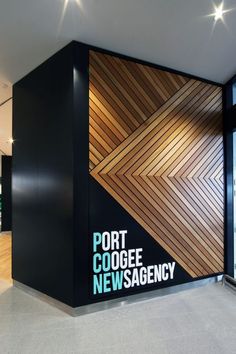 the entrance to port coogge newsagency is decorated with wood planks