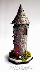 a small house made out of bricks and moss