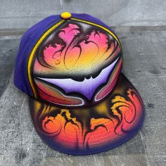 This is an airbrushed snapback hat featuring a Purple Bat design.  This hat is adjustable and will fit almost anyone.  These hats are waterproof and can withstand a good soaking but they should not be washed in a washing machine or dish washer.  Thank you, Brad.  Shipping is free for this item anywhere in the US. Purple Music, Airbrush T Shirts, Electric Purple, Bat Design, East Lansing, Lansing Mi, Dish Washer, Air Brush, Music Note