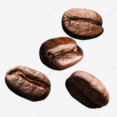 three coffee beans falling into the air