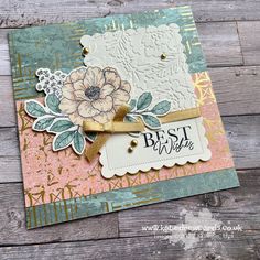 a close up of a card on a wooden surface with the words best wishes written in it