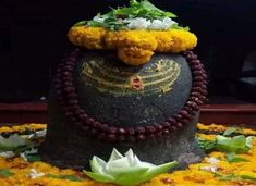 an elaborately decorated hat with flowers on it