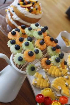 cupcakes and pastries are arranged on the table