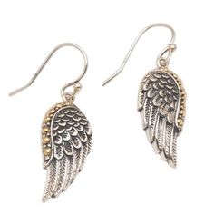 Two wings of a swan are crafted in sterling silver to dangle from the ears with purity. Kadek Wijanegara presents an unforgettable pair of dangle earrings from Bali. Each wing is accentuated with petite bubbles of 18k gold. Elegant Angel Wings Earrings, Elegant Winged Earrings For Gift, Silver Sterling Silver Winged Earrings, Silver Winged Sterling Silver Earrings, Winged Sterling Silver Earrings In Silver, Sterling Silver Winged Earrings Gift, Winged Sterling Silver Earrings For Gift, Winged Sterling Silver Earrings As Gift, Elegant Angel Wings Earrings As Gift