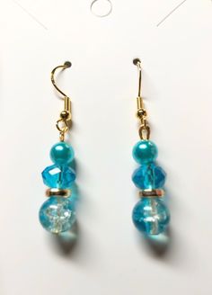 Caribbean blue dangle drops On gold plated hypoallergenic earring hooks Blue Dangle Hoop Earrings, Blue Dangle Clip-on Earrings For Gift, Blue Dangle Hoop Earrings Hypoallergenic, French Hook Beaded Drop Earrings, Handmade Blue Dangle Pearl Earrings, Blue Dangle Pearl Earrings, Handmade Blue Pearl Drop Earrings, Blue Long Drop Chandelier Earrings, Adjustable Light Blue Earrings