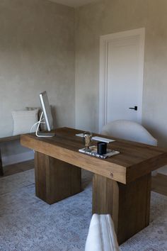 a wooden table sitting in the middle of a living room