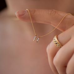 "The personalized initial necklace with baguette diamonds will add a sweet and shimmering note to your individual style! Materials: 18k solid gold | baguette cut diamonds Available letters: A, B, C, D, E, F, G, H, I, J, K, L, M, N, O, P, Q, R, S, T, U, V, W, X, Y, Z Chain with a gold clasp: 40 cm/15.748\" Available in YELLOW, WHITE or ROSE 18k gold. Information about Our White Gold: We do not add rhodium plating to our gold items; the natural color of the white gold is retained. As a result, the Elegant Initial Pendant Necklace With Letter Beads, Elegant Letter Beads Necklace For Anniversary, Elegant Everyday Necklace With Letter Beads, Elegant Anniversary Necklace With Letter Beads, Elegant Everyday Letter Beads Necklace, Elegant Name Necklace With Letter Beads For Anniversary, Baguette Cut Diamond, Grey Diamond, Personalized Initials