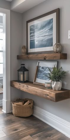 a wooden shelf sitting on the side of a wall next to a basket and lantern