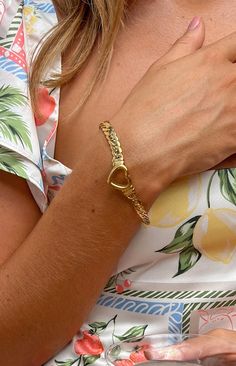 Gold Plated Heart Bracelet  How to style: For an effortlessly elevated look. add this beautiful simple gold bracelet to your outfit. This bracelet is chunky enough to stand out in a basic outfit or simple enough to blend in when paired with your next going out ensemble.  Features: Thick gold chain Clasp closure Outlined heart pendant Adjustable length Metal Heart Bracelet For Everyday, Everyday Heart Bracelet For Valentine's Day, Everyday Gold Plated Heart Bracelet, Gold Heart Charm Bangle Bracelet, Trendy Gold Heart Bracelet With Heart Charm, Everyday Heart-shaped Gold Plated Bracelets, Gold Heart Bracelet With Heart Charm, Gold Bangle With Heart Charm, Everyday Heart-shaped Jubilee Bracelet