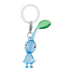 a keychain with a cartoon character holding a green leaf on it's back