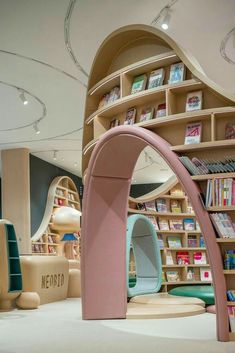 the interior of a children's book store with bookshelves and toys on display