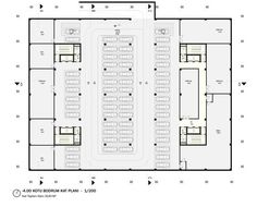 the floor plan for an office building with two rows of tables and chairs in it