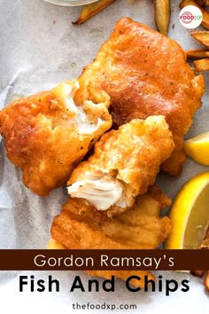 fried fish and chips with lemon wedges on the side