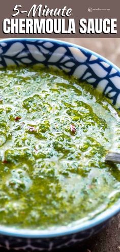 a bowl filled with green sauce on top of a wooden table and text overlay that reads 5 minute chemoula sauce