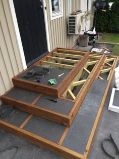 an outdoor patio being built with wood and concrete