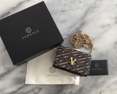 100% authentic Versace wallet on a chain. Purchase from Saks 5th Ave., Honolulu. Brand new. Smoke free home. Comes with wallet bag, duster, authenticity card, and box. Please take a look at all the pictures. And ask any questions. All sales final. Thank you Gold Rectangular Wallet On Chain For Gift, Gold Rectangular Wallet On Chain As Gift, Designer Gold Wallet On Chain, Rectangular Wallet On Chain Gift, Luxury Rectangular Wallet On Chain As Gift, Classic Rectangular Wallet On Chain As Gift, Luxury Wallet On Chain For Gift, Designer Wallet On Chain With Chain Strap, Elegant Gold Wallet On Chain For Gift