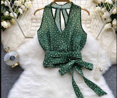 Summer Blouse With V-neck And Vest Detail, Green Vest Tops For Vacation, Spring Halter Neck Blouse With Floral Print, Spring Floral Print Halter Neck Blouse, Green Vest Top For Spring, Green Summer Vest Top, Summer Green Vest Top, Green Cami Blouse For Spring, Chic Green Blouse With Vest Detail