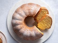 a bundt cake on a plate with one slice cut out