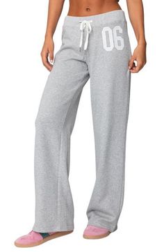 Sporty numbering at the thigh lends ultracool athletic style to these cozy cotton-blend sweatpants made with trendy wide legs. Elastic/drawstring waist 50% cotton, 50% polyester Machine wash, dry flat Imported Sporty Sweatpants With Letter Print For Loungewear, Sporty Letter Print Sweatpants For Loungewear, Casual Sports Sweatpants With Drawstring, Casual Letter Print Sweatpants For Loungewear, Full-length Drawstring Sweatpants For Sports, Full Length Drawstring Sweatpants For Sports, Letter Print Athleisure Pants For Loungewear, Trendy Cotton Sweatpants With Comfort Waistband, Cotton Athleisure Sweats For Sports Season