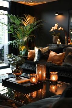 a living room filled with lots of furniture and candles on top of a coffee table