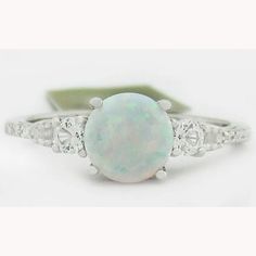 a white opal and diamond ring