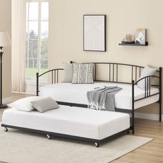 a day bed with pull out trundle in a living room