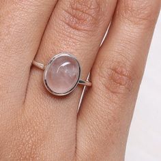 Natural Rose Quartz Ring, 925 Sterling Silver Ring, Gemstone Ring, Solitaire Ring, Oval Shaped Ring, Bohemian Ring, Handmade Silver Jewelry Gemstone Name - Rose Quartz  Stone Quality - AAA Ring Weight - 2.84  gm Ring Length - 1.1 cm Ring Width -  1 cm Stone Shape - As shown in the picture Ring Size - All Ring Size Available    * You Will Get The Same Product As Shown In The Picture. We serve complete 925 sterling silver Jewelry and genuine properties of the stone. The products are dispatched from the small business from USA. Product Quality and Packaging - Our all products are 925 Silver Stamped which shows that the product is genuine and authentic .The products are dispatched from the small business from USA so you get the product on time and the product packaging comes in bubble foil wra Solitaire Ring Oval, Handmade Silver Jewelry, Bohemian Ring, Rose Quartz Ring, Rose Quartz Stone, Bohemian Rings, Rose Quartz Gemstone, Healing Jewelry, Ring Oval