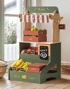 a wooden toy stand with fruits and vegetables