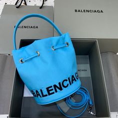 Balen Le Cagole Medium Bucket Bag In Light Blue Balenciaga Bag, Bago, Shoulder Pads, Monaco, Bucket Bag, Designing Women, Fashion Bags, Contact Us, Balenciaga