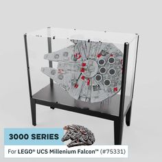 a star wars millennium falcon model on display in a glass case with the words, 300 series for lego u s millennium falcon 75351