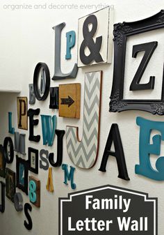 the family letter wall is decorated with letters from different eras and sizes, including one for each letter