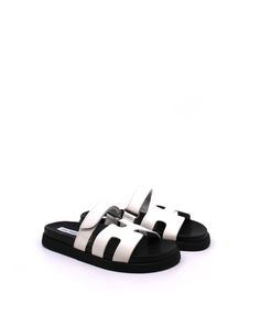 Step up your shoe game with the MAYVEN leather slides. These stylish kicks feature a comfy molded footbed, a cool geometric cutout design on the front strap, and an adjustable top strap. Plus, the treaded flatform sole adds some playful height to your look. So, why wait? Get your hands on these must-have slides now! Trendy White Sandals With Rubber Sole, Trendy Slides With Leather Footbed And Round Toe, Trendy Leather Slides With Textured Footbed, Trendy Leather Sport Sandals With Textured Footbed, Trendy Leather Slides With Rubber Sole, Modern Slip-on Footbed Sandals With Rubber Sole, Trendy Flat Slides With Leather Footbed, Modern Slide Sandals With Rubber Sole, White Flat Platform Slides