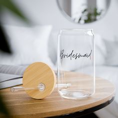 there is a glass jar with the word bridesmaid on it