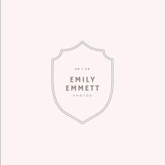 a white and gray logo with the words, family emmett photos on it