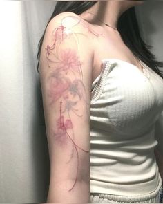 a woman with a tattoo on her arm