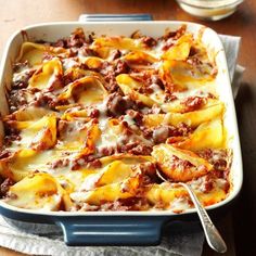 a casserole dish filled with pasta and meat