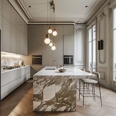 a kitchen with marble counter tops and stools next to an island in the middle